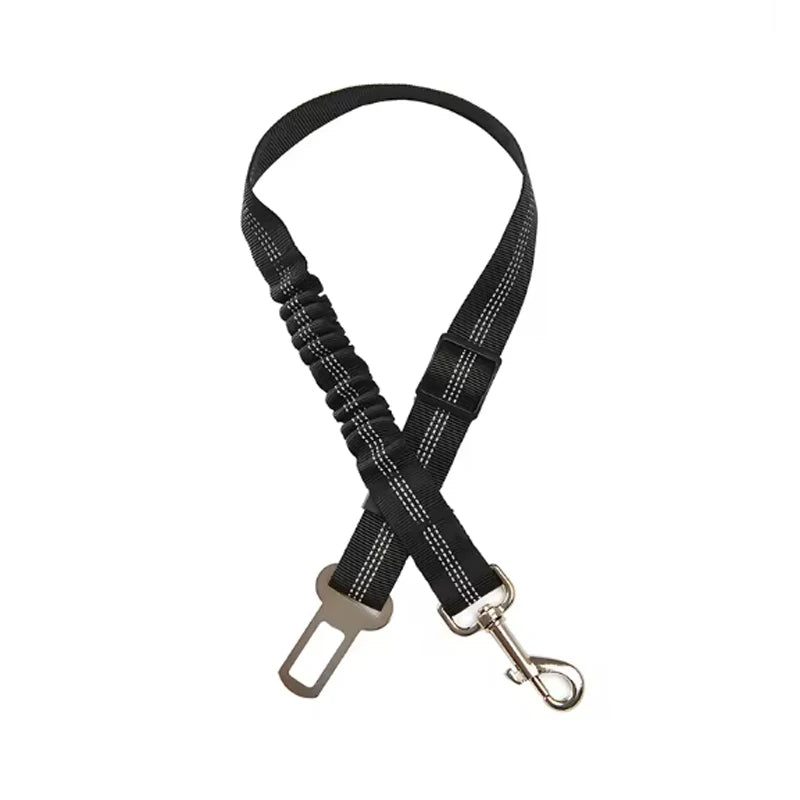 Adjustable reflective dog car safety belt with shock-absorbing strap.