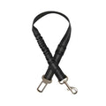 Adjustable reflective dog car safety belt with shock-absorbing strap.