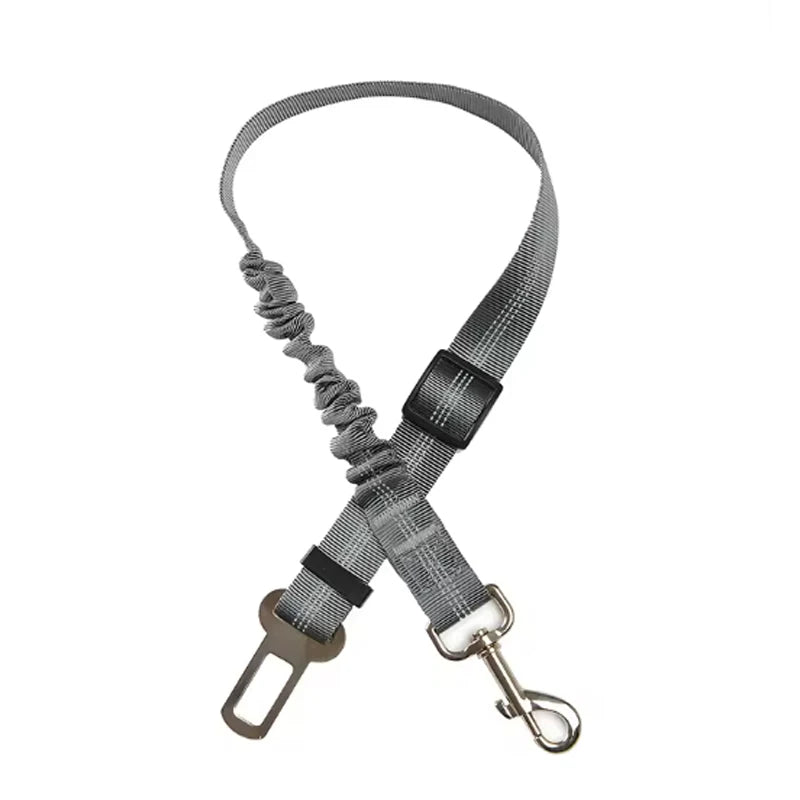 Adjustable reflective dog car safety belt with shock-absorbing strap.