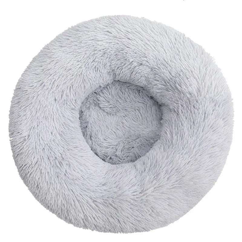 Soft plush round pet bed for cats and dogs – warm and comfortable sleeping bed in multiple sizes.