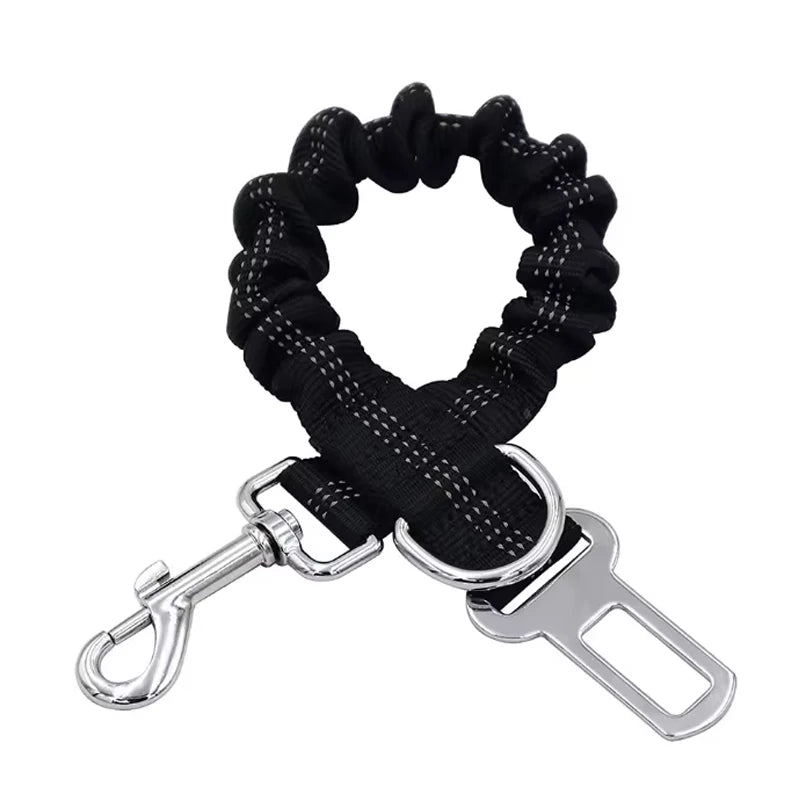 Adjustable reflective dog car safety belt with shock-absorbing strap.