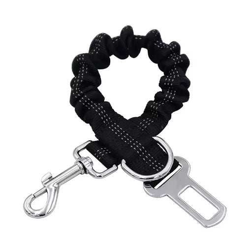 Adjustable reflective dog car safety belt with shock-absorbing strap.
