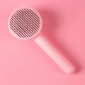 Self-cleaning pet grooming brush for dogs and cats