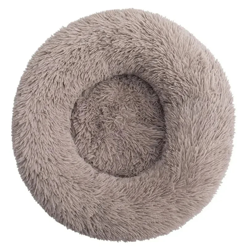 Soft plush round pet bed for cats and dogs – warm and comfortable sleeping bed in multiple sizes.