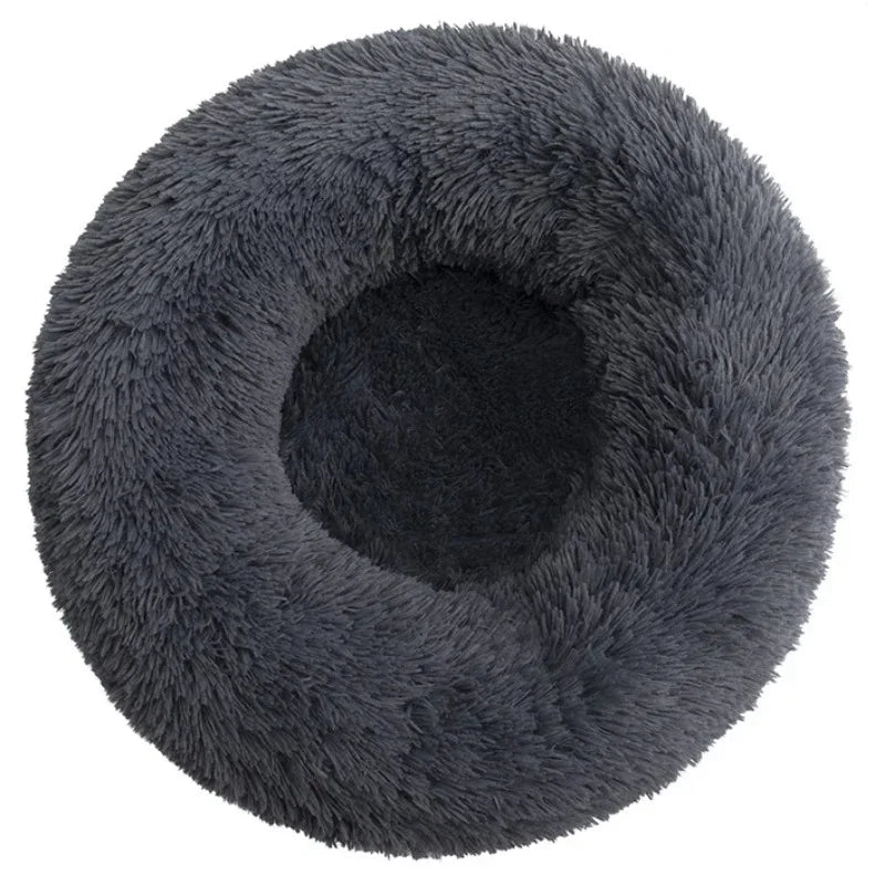 Soft plush round pet bed for cats and dogs – warm and comfortable sleeping bed in multiple sizes.