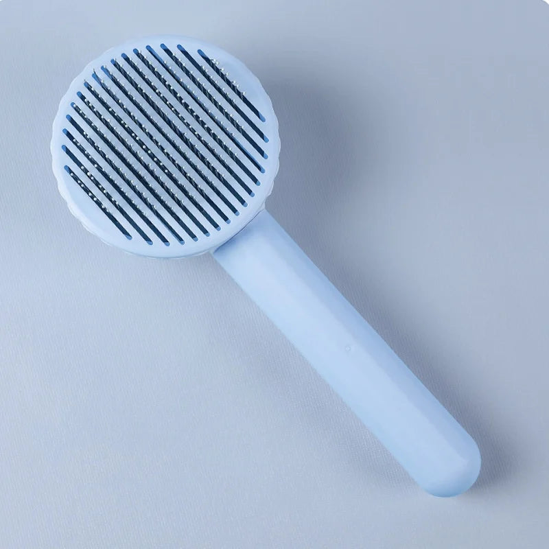 Self-cleaning pet grooming brush for dogs and cats