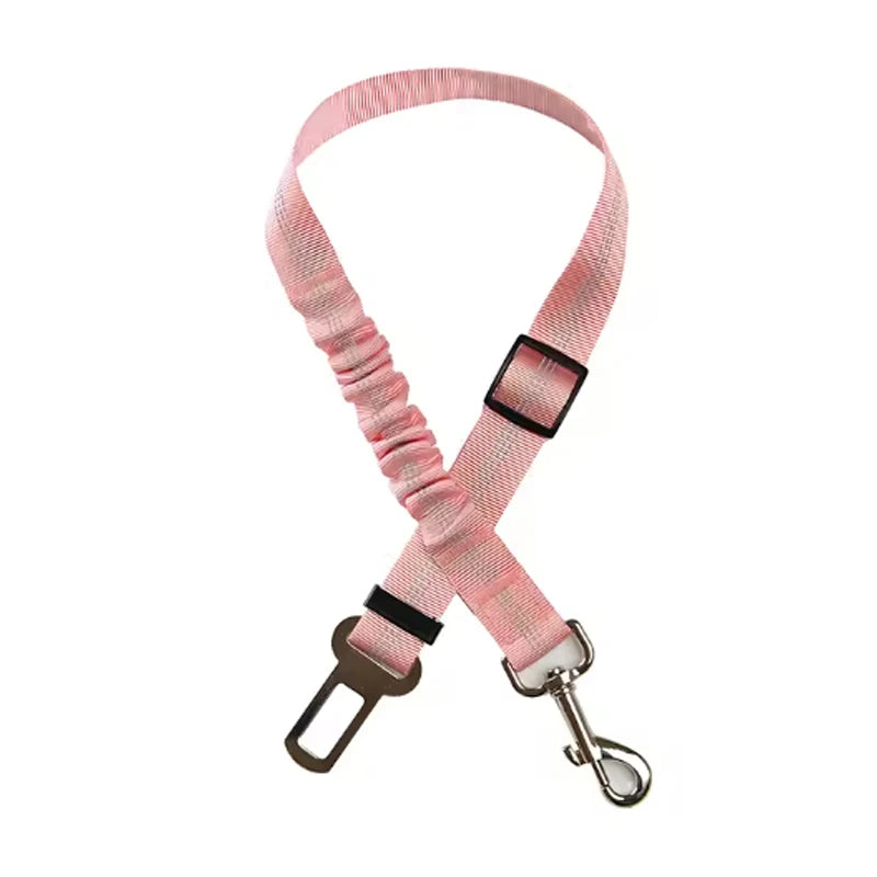 Adjustable reflective dog car safety belt with shock-absorbing strap.
